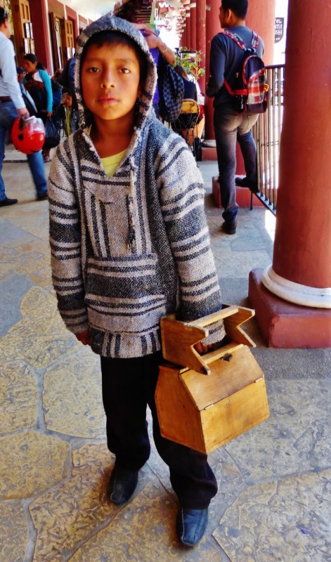The youngest shoe-shine.  I paid him 5 pesos for the photo, but that didn’t come with a smile.