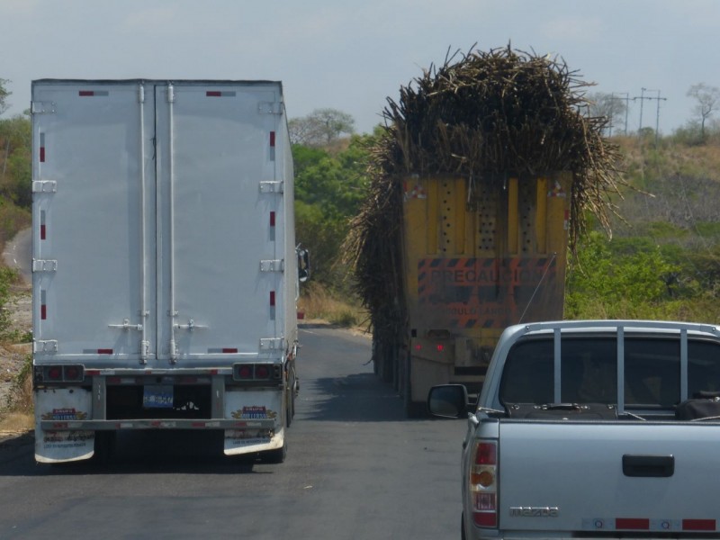 An interesting study in the contrast between trucks while driving through Honduras… and wondering how to get around them! 