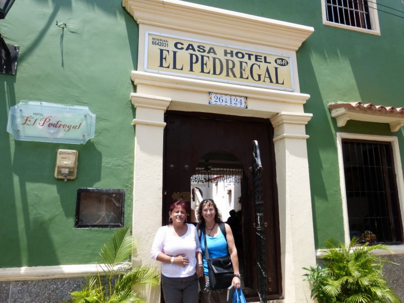 We had found an inexpensive, but cute hotel on the internet near the "Walled City" in the old part of town. The taxi ride from the airport was short, and when we pulled into the ancient, tiny streets of the neighborhood we were delighted!  Hotel Pedregal turned out to be wonderful.  The owner, Patricia, was warm and welcoming, assuring us that this was our home while we were in Cartagena. Our room was charming, featuring a colonial style vaulted ceiling and windows (sans glass) with wooden shutters, which looked out on the street below where cheerful locals hung out, enjoying their Saturday.