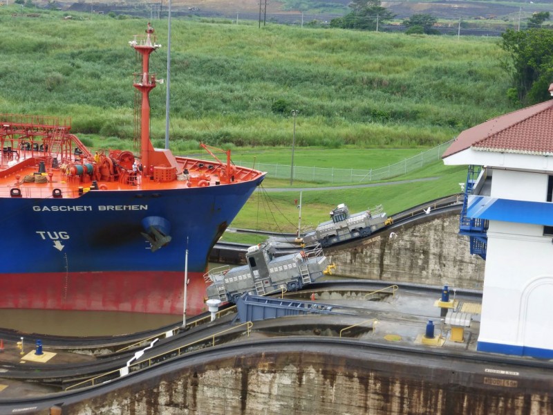 Next these powerful electric tugs on both sides of the lock hook on to the ship and pull it ahead into the next lock.  Not only must they pull the boat, but they must also climb the 45% grade of their tracks to reach the height of the next lock.